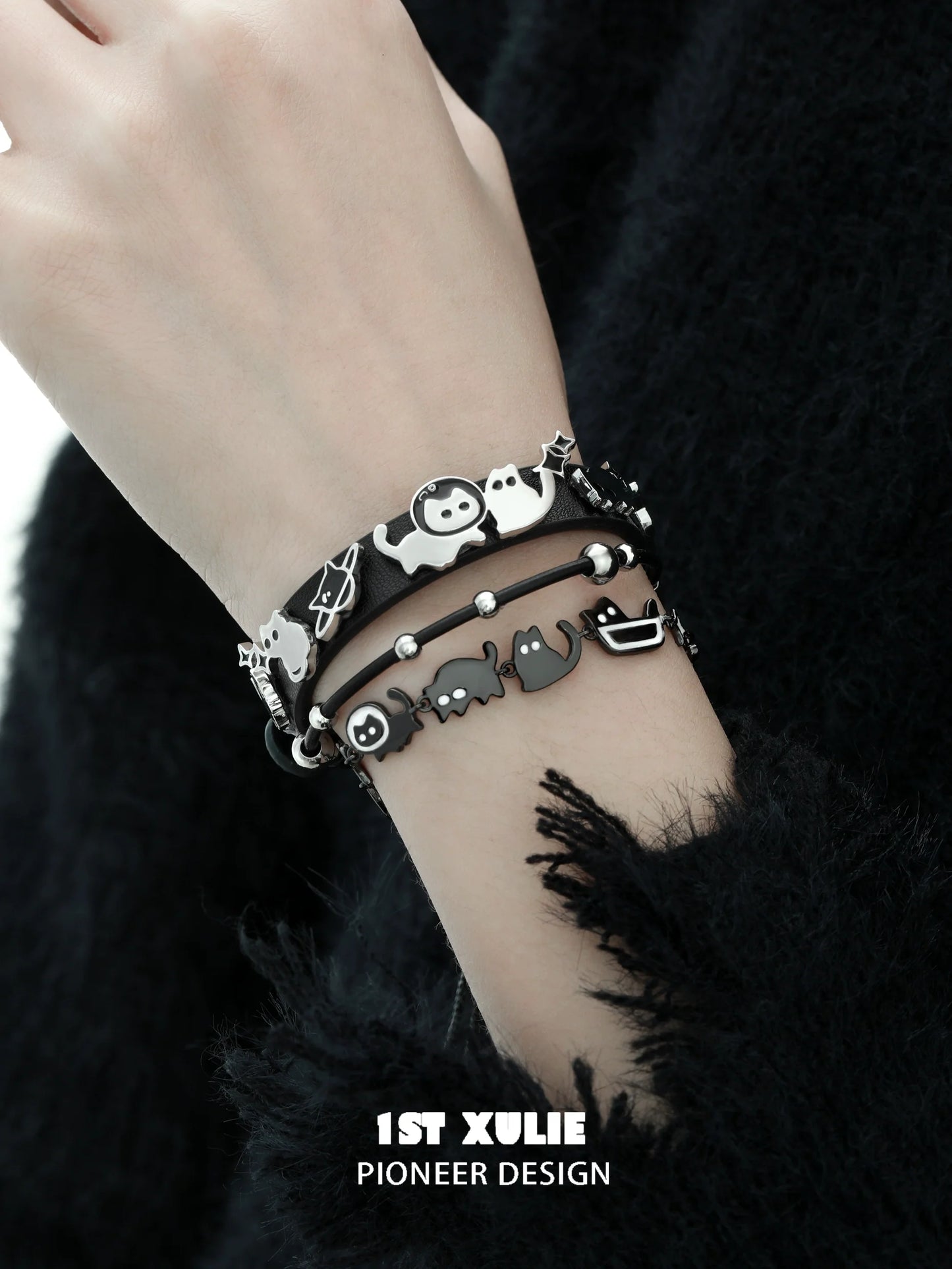 Stylish black cat bracelet set with playful charms for cat lovers and fashion enthusiasts