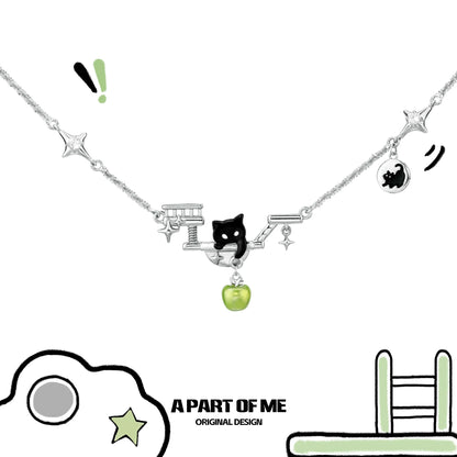 Black cat necklace by A PART OF ME featuring a playful design with charms and a silver chain
