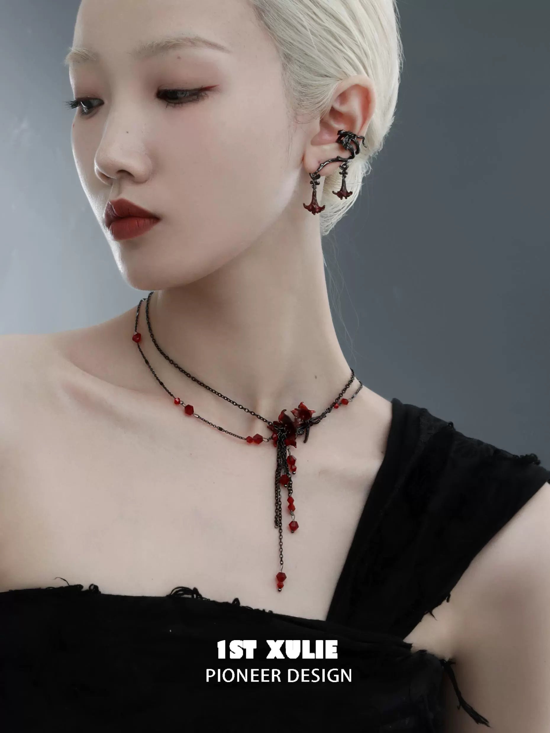 Blood mandala tassel necklace with intricate detailing and a stylish design, worn by a model