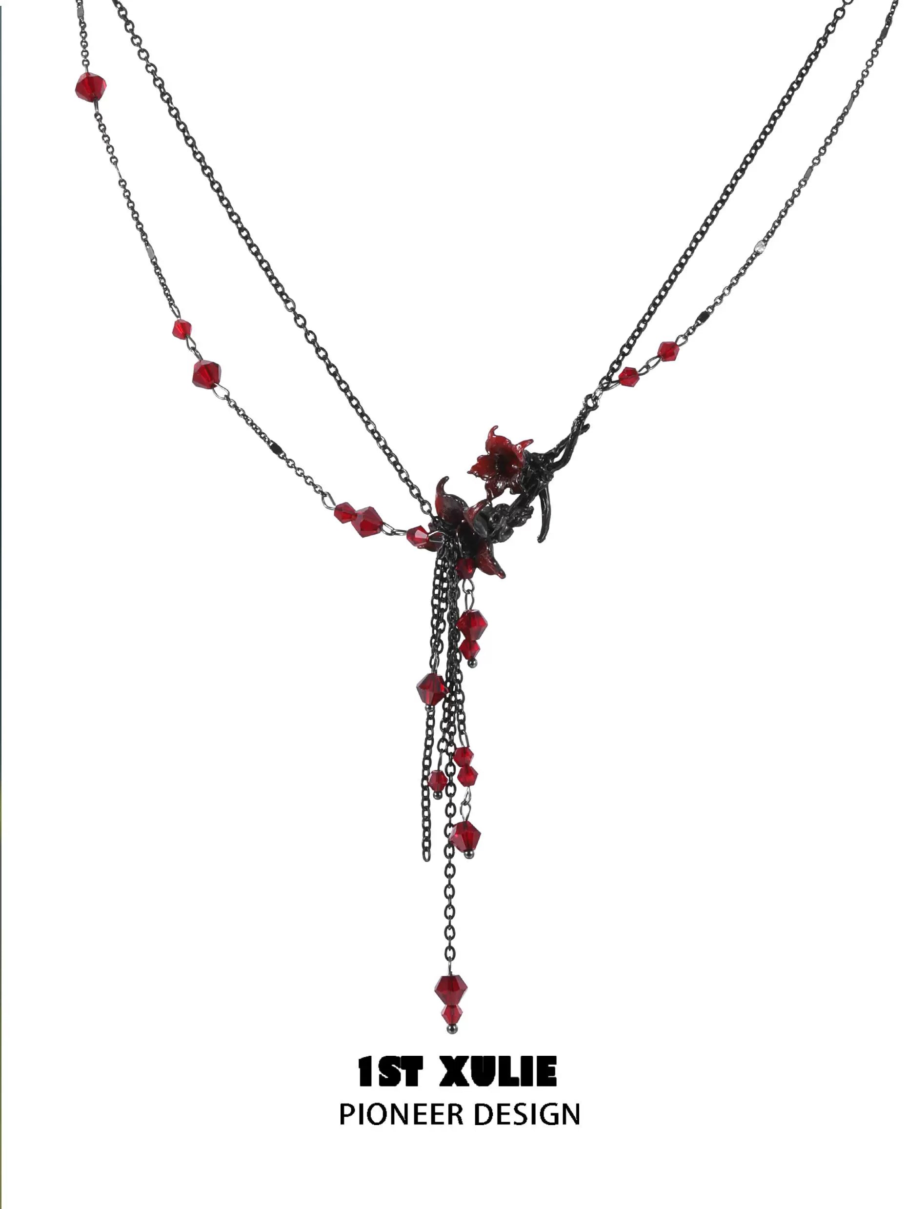 Blood mandala tassel necklace featuring dark chains and red crystal accents for a chic look