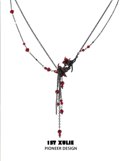 Blood mandala tassel necklace featuring dark chains and red crystal accents for a chic look