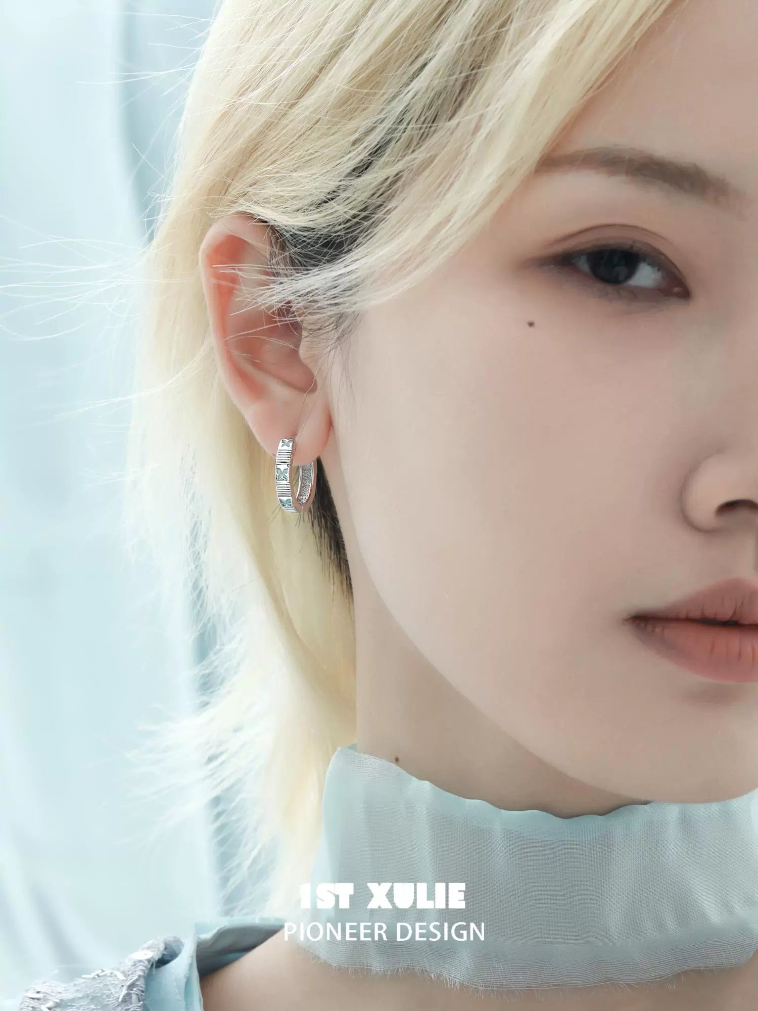 Elegant blue butterfly earrings from 1STXULIE with sparkling details for a chic look
