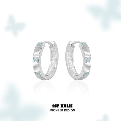 Elegant silver hoop earrings featuring blue butterfly earrings for a stylish look
