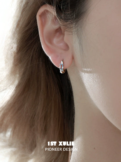 Elegant silver hoop earrings featuring blue cosmic earrings, perfect for any occasion