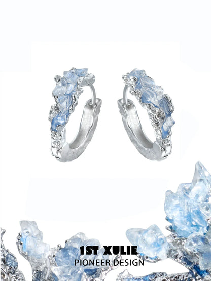 Stylish blue crystal ear cuffs from 1STXULIE featuring intricate designs and a shimmering finish