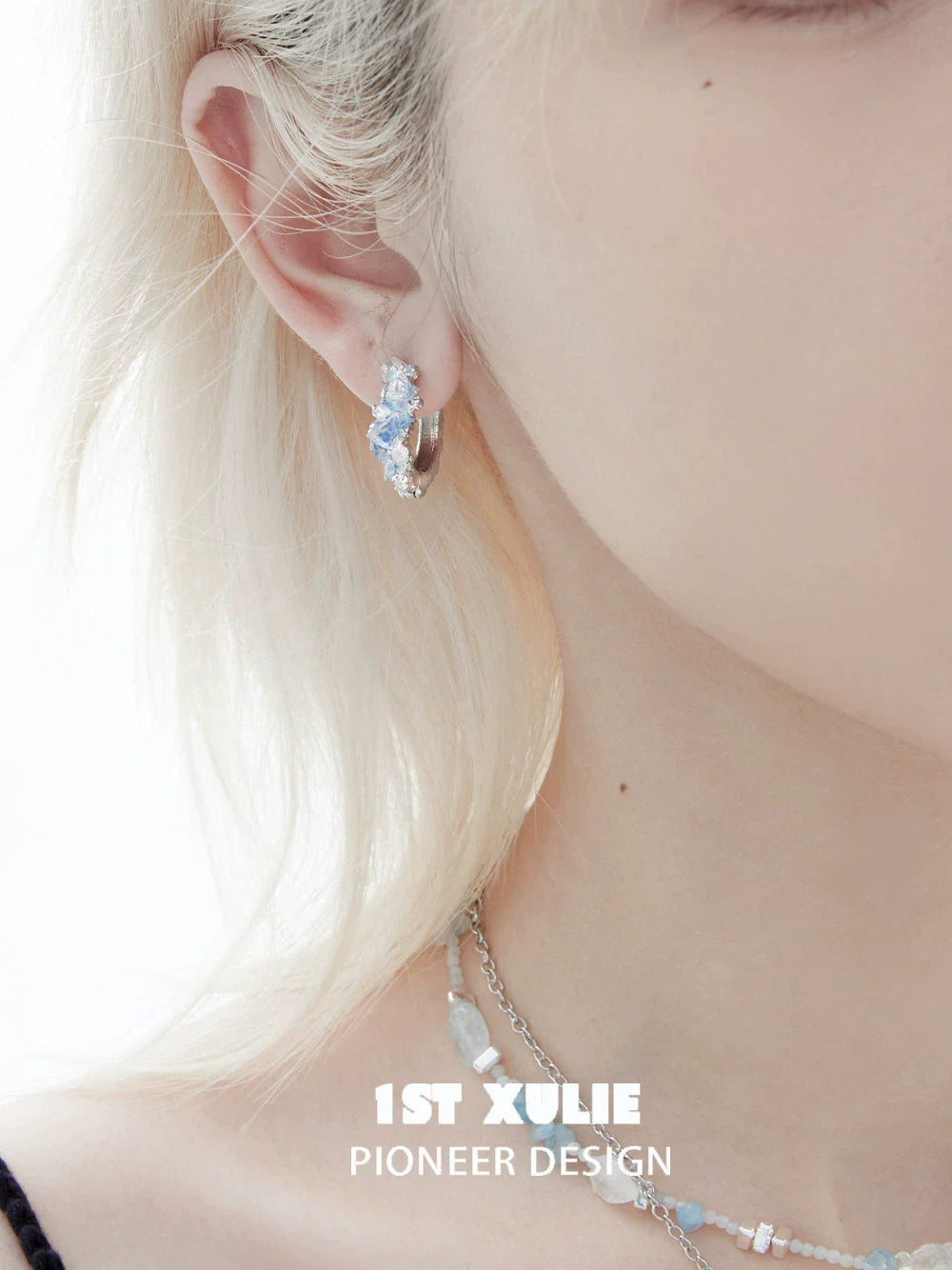 Fashionable blue crystal ear cuffs by 1ST XULIE displayed on a model, perfect for trendy outfits