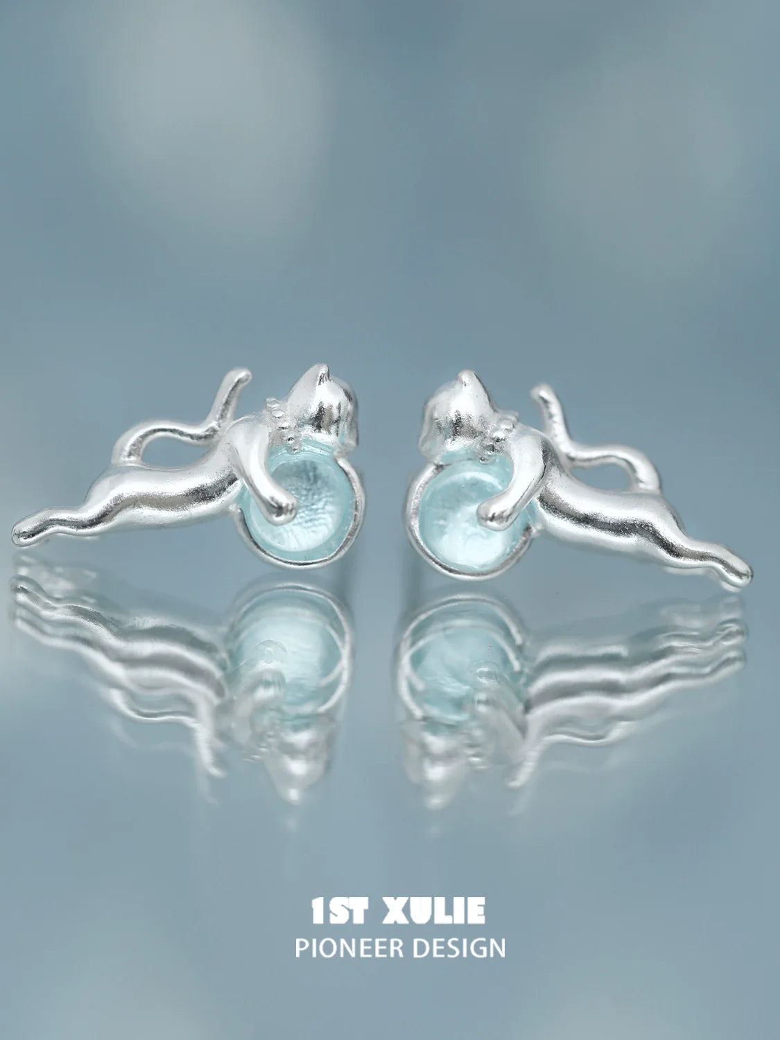 Unique silver blue kitten earrings for women featuring playful cat design and light blue accents