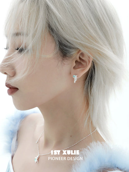Stylish blue kitten earrings for women showcased on a model with short hair