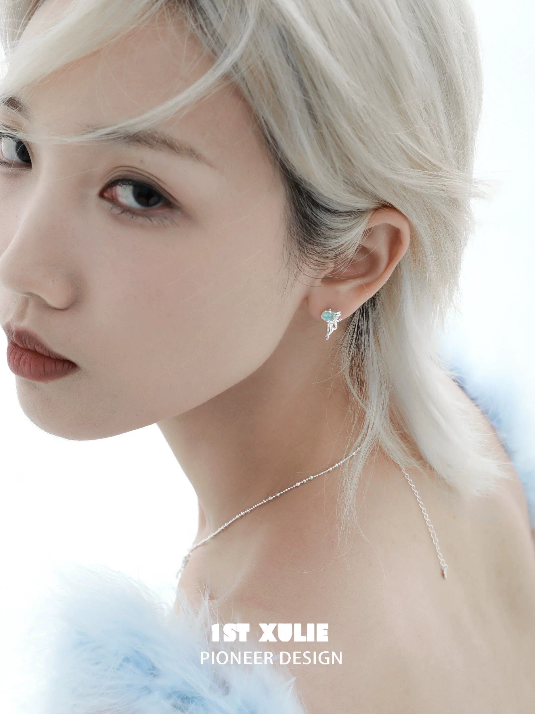 Stylish blue kitten earrings for women, designed by 1STXULIE, showcased on a model