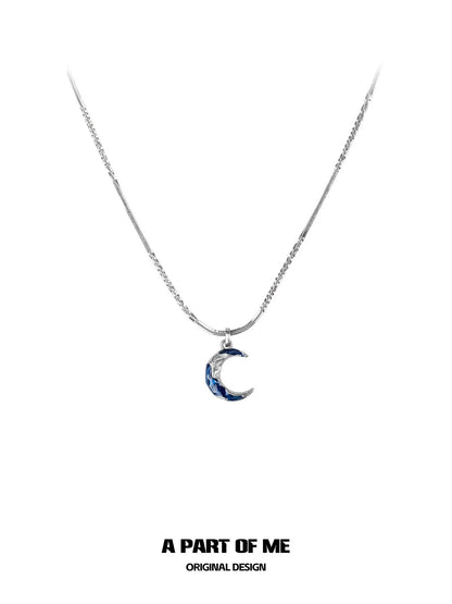 A PART OF ME blue moon pendant necklace featuring a delicate chain and crescent moon charm