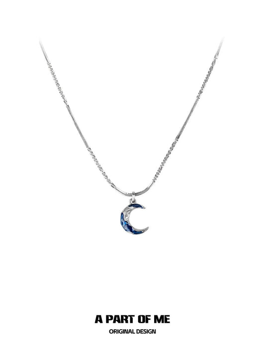 A PART OF ME blue moon pendant necklace featuring a delicate chain and crescent moon charm