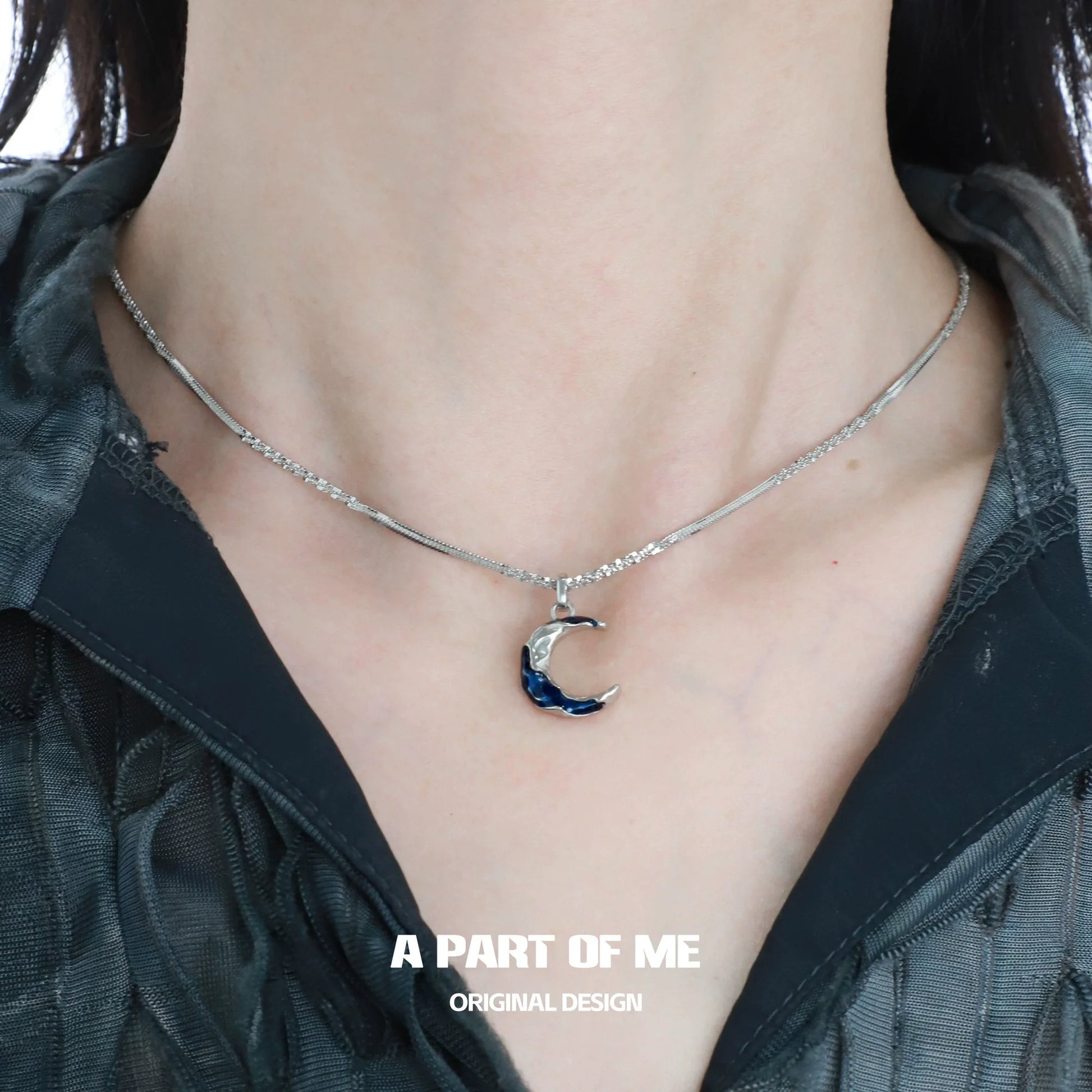 Elegant blue moon pendant necklace from A PART OF ME featuring a silver chain and crescent moon design