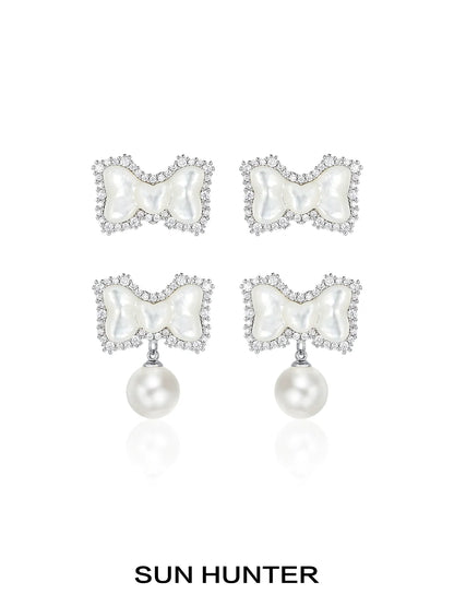 SUN HUNTER bow pearl earrings featuring a elegant bow design adorned with sparkling crystals