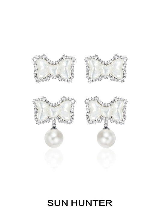 SUN HUNTER bow pearl earrings featuring a elegant bow design adorned with sparkling crystals