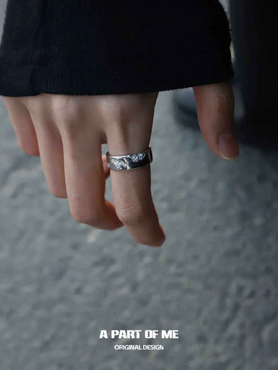 A PART OF ME broken silver ring displayed on a hand with casual attire