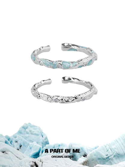 A PART OF ME broken starry sky ring in silver with a textured finish and light blue accents