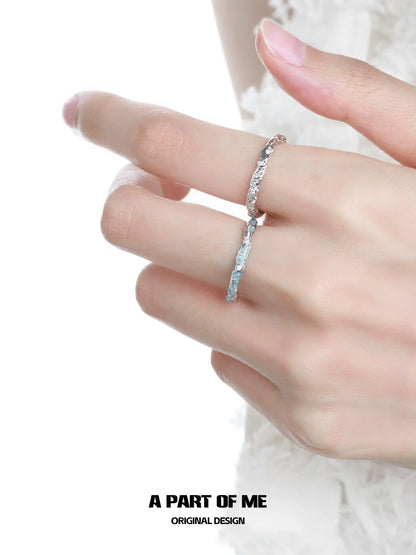 A PART OF ME broken starry sky ring displayed on a hand with a delicate design and sparkling accents