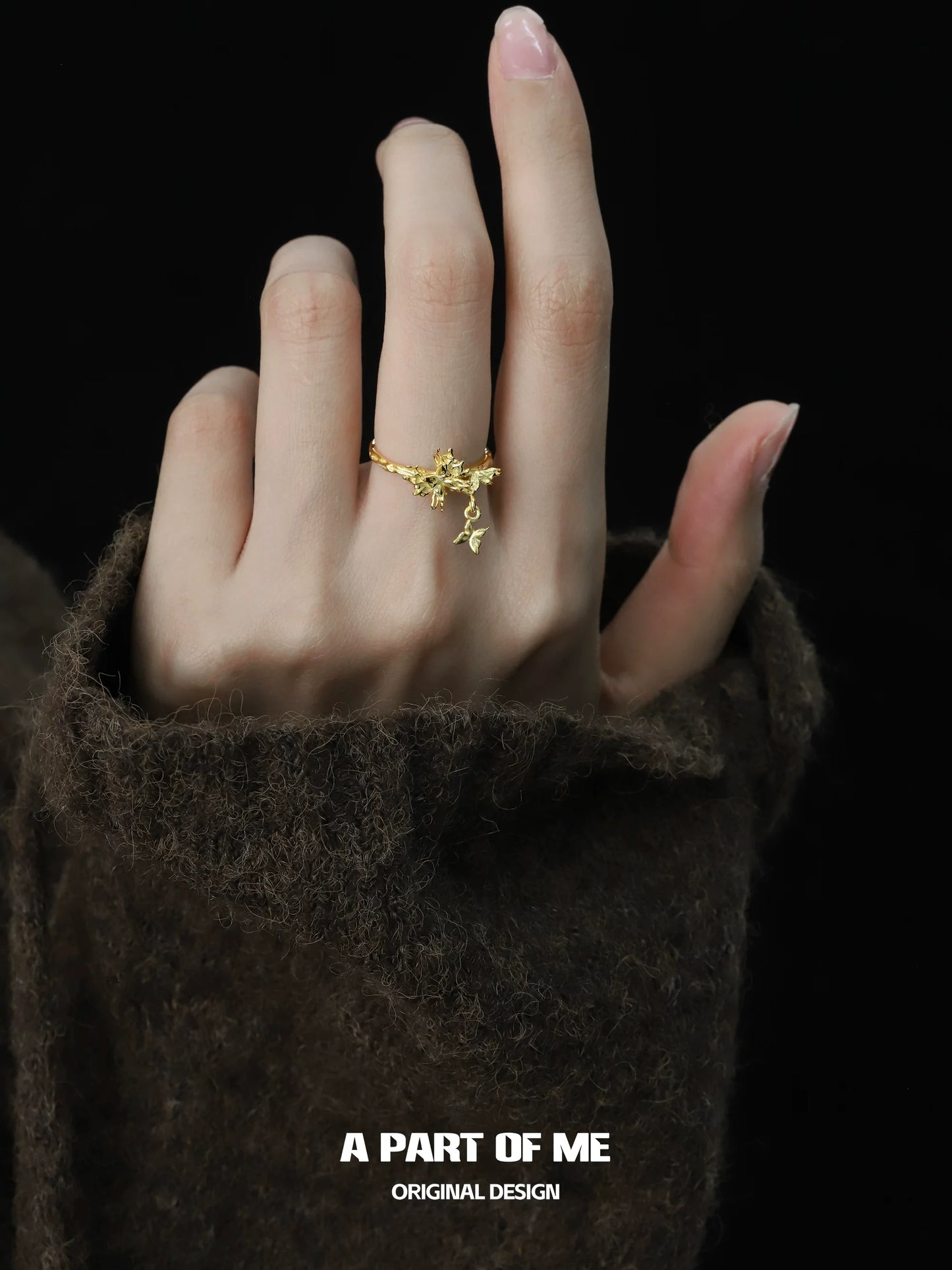 A Part of Me Butterfly Charm Silver Ring shown on a hand wearing a cozy sweater