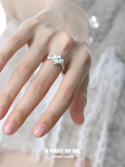 Elegant butterfly clover silver ring on a model's hand showcasing detailed design and craftsmanship
