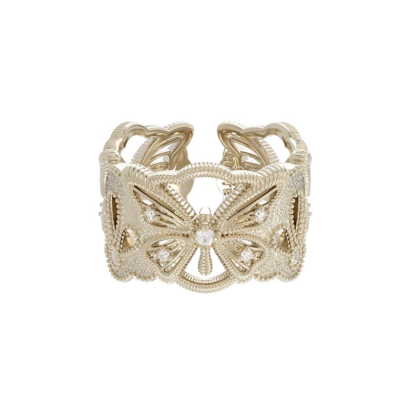 SUN HUNTER butterfly hollow ring in gold with intricate design and shimmering accents