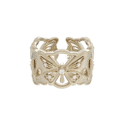 SUN HUNTER butterfly hollow ring in gold with intricate design and shimmering accents