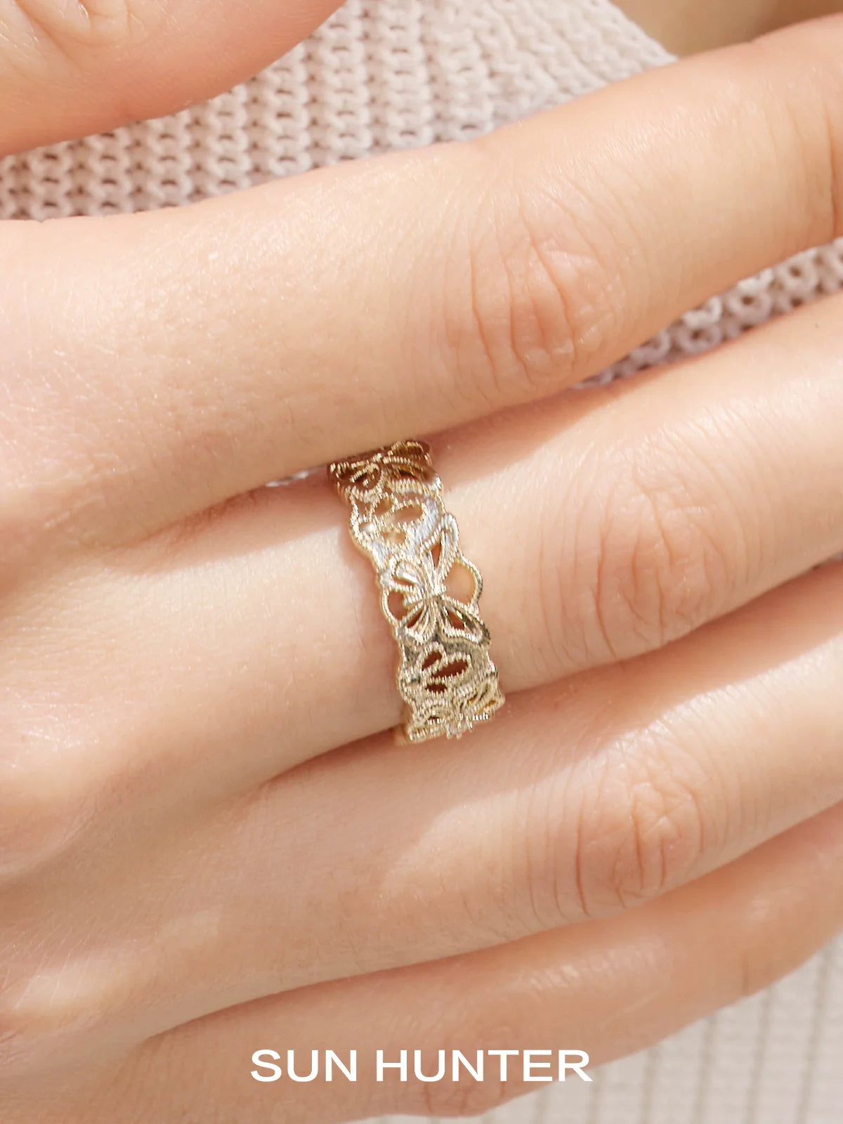 Elegant SUN HUNTER butterfly hollow ring featuring intricate lace design in gold