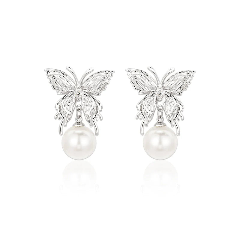 SUN HUNTER butterfly pearl earrings featuring elegant butterfly design with luminous pearls