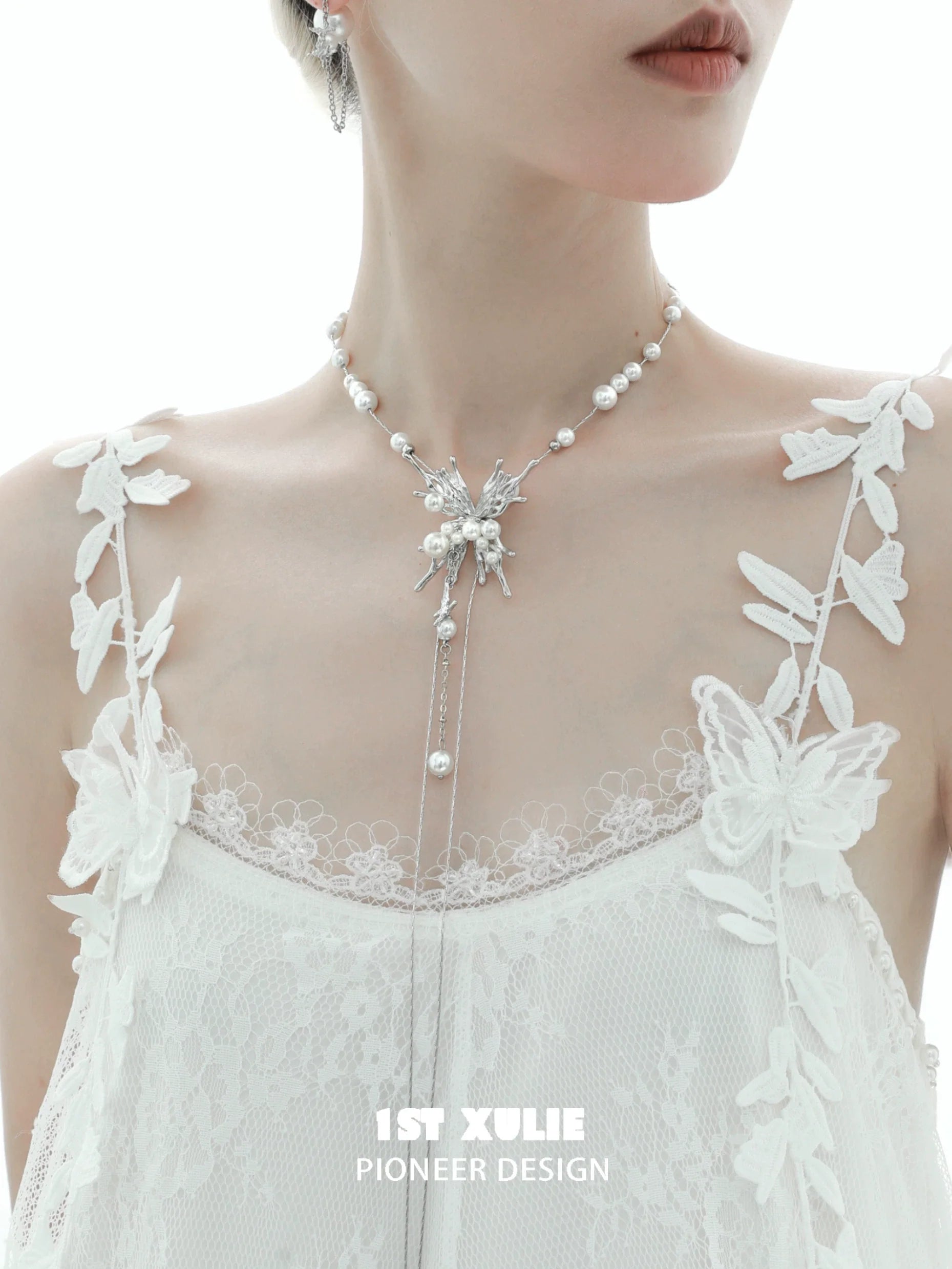Elegant butterfly pendant necklace from 1STXULIE featuring intricate floral designs and shiny pearls