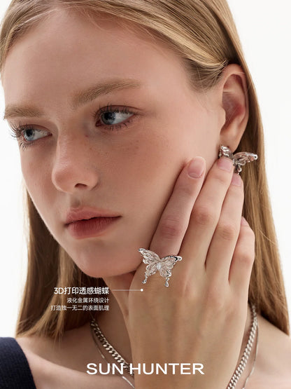 Elegant SUN HUNTER butterfly ring for women with intricate 3D design, showcased on model's hand