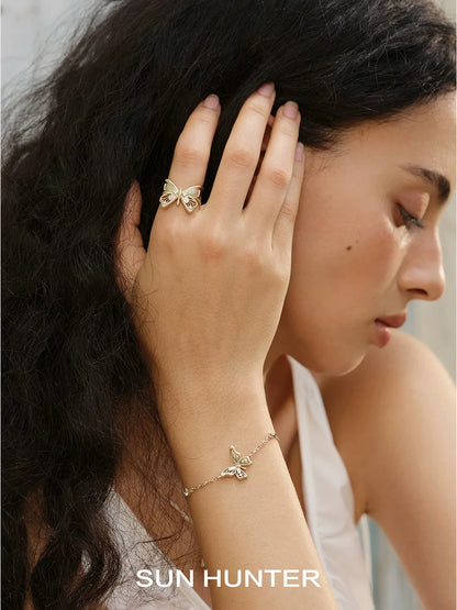 Elegant butterfly silver bracelet showcased on a model's wrist for a stylish look