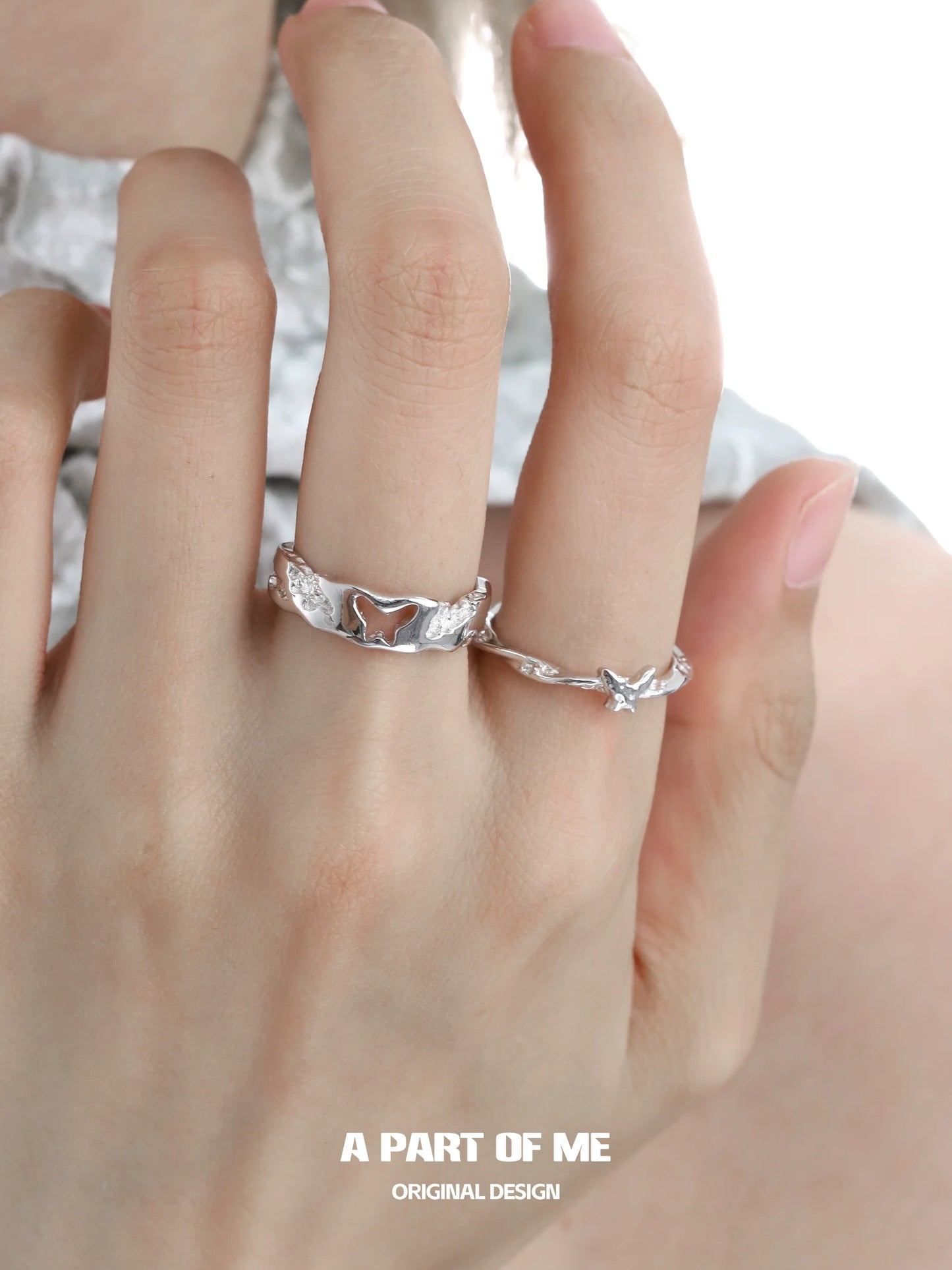 A PART OF ME butterfly silver ring worn on a hand with elegant design and butterfly motifs