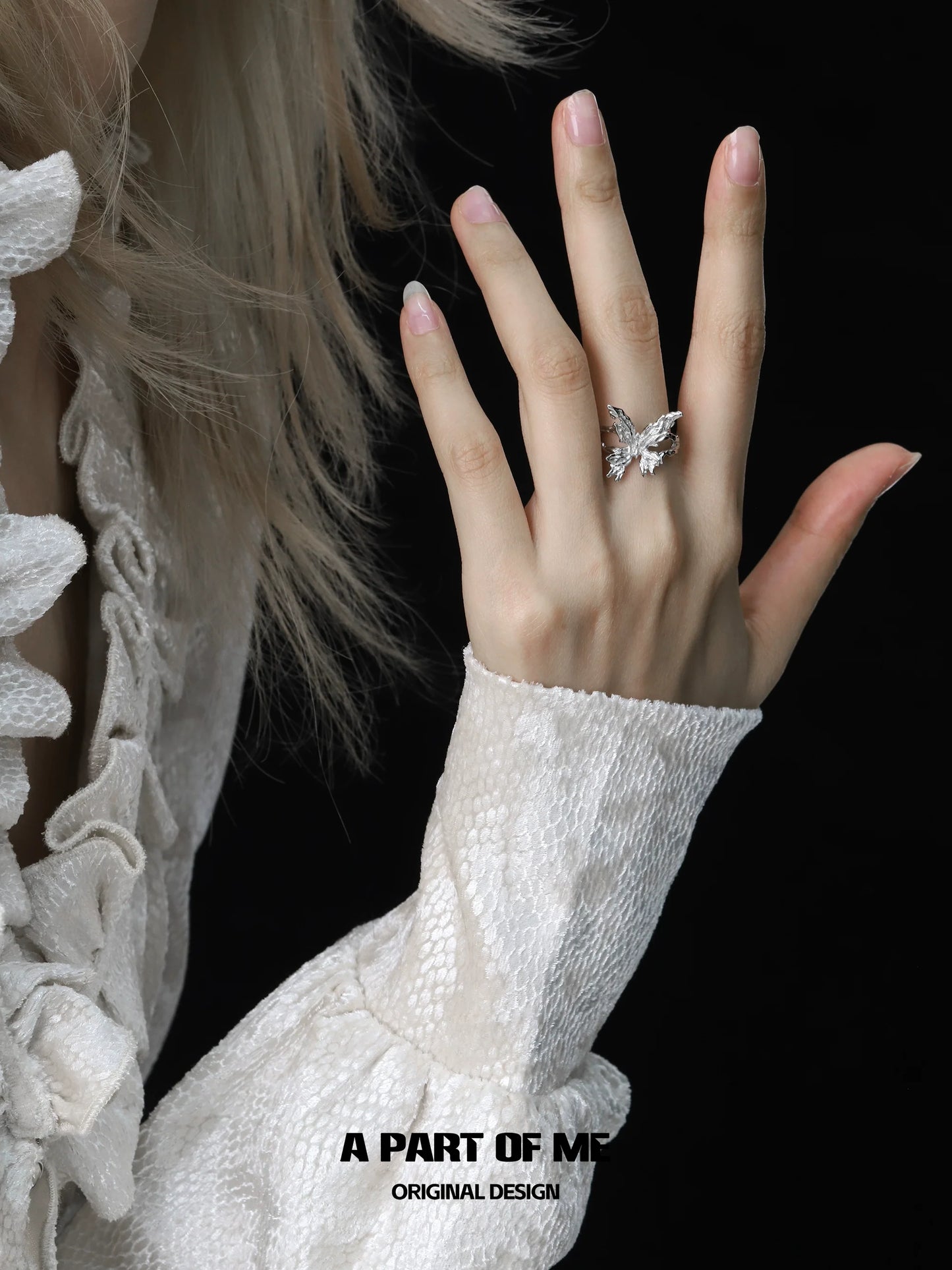 Delicate butterfly silver ring on hand, showcasing intricate design and elegance from A PART OF ME