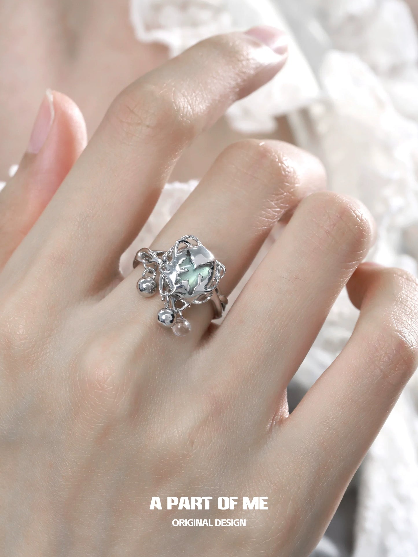 A PART OF ME butterfly silver ring featuring a stunning gemstone and intricate detailing on the band