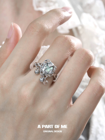 A Part of Me butterfly silver ring featuring a faceted gemstone and intricate detailing on a hand