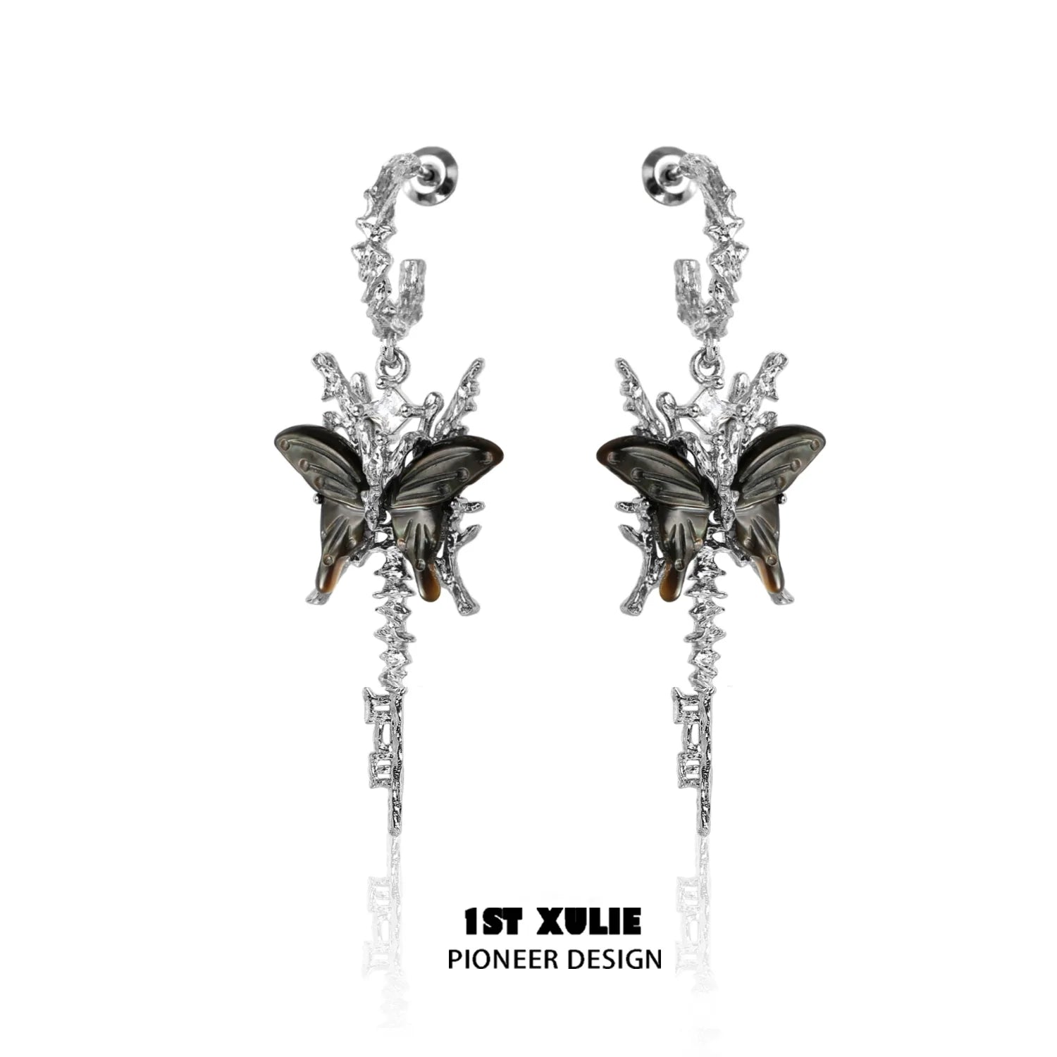 Elegant butterfly tassel shell earrings in silver with intricate design and butterfly accents