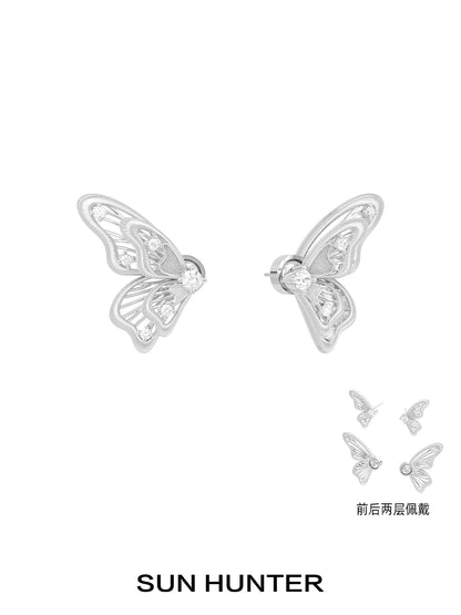 Elegant SUN HUNTER butterfly wing earrings with intricate design and sparkling crystals