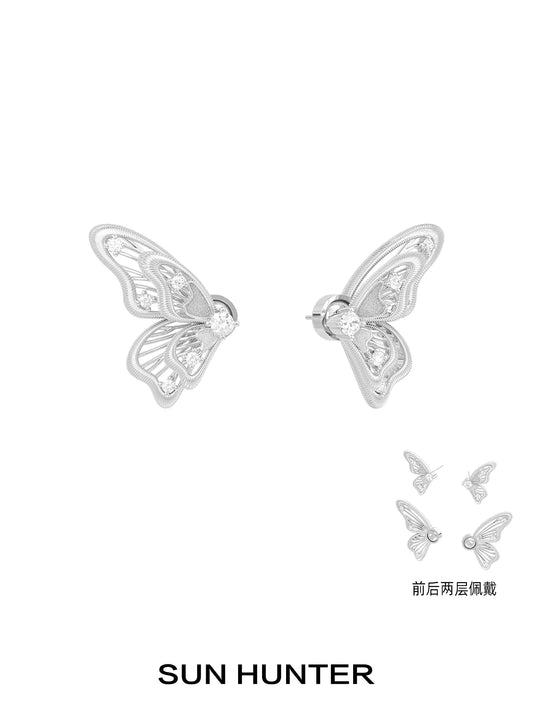 Elegant SUN HUNTER butterfly wing earrings with intricate design and sparkling crystals