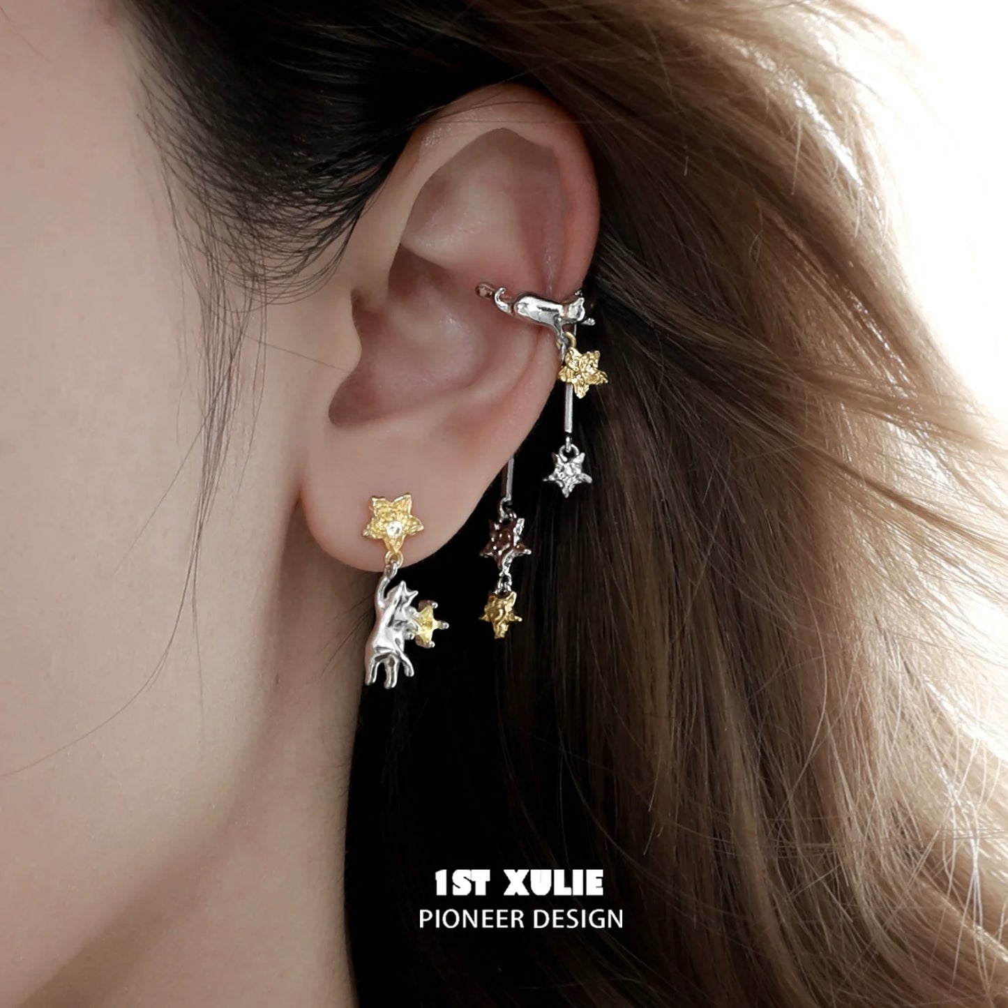 Stylish 1STXULIE cat ear cuffs in silver and gold, featuring playful cat designs for a trendy look