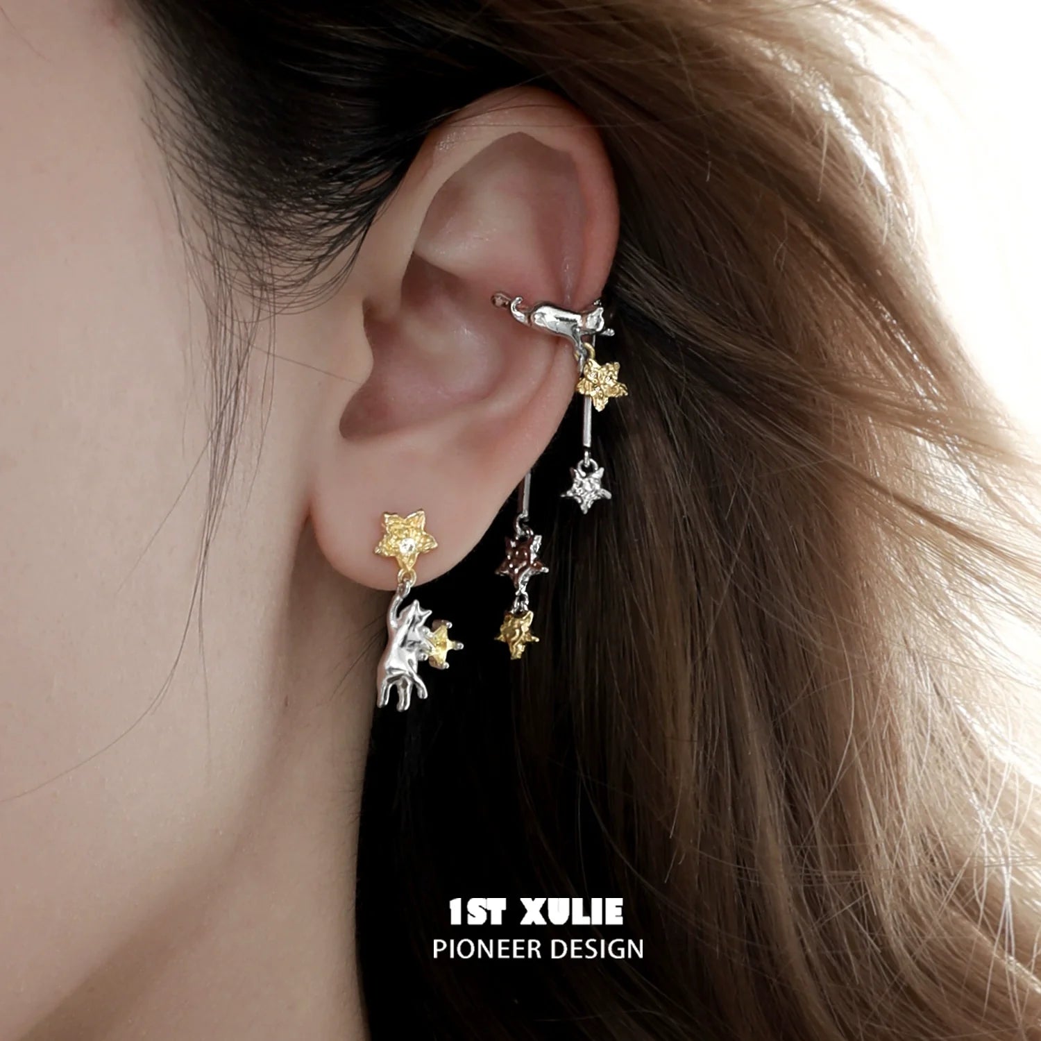 Stylish 1STXULIE cat ear cuffs in silver and gold, featuring playful cat designs for a trendy look