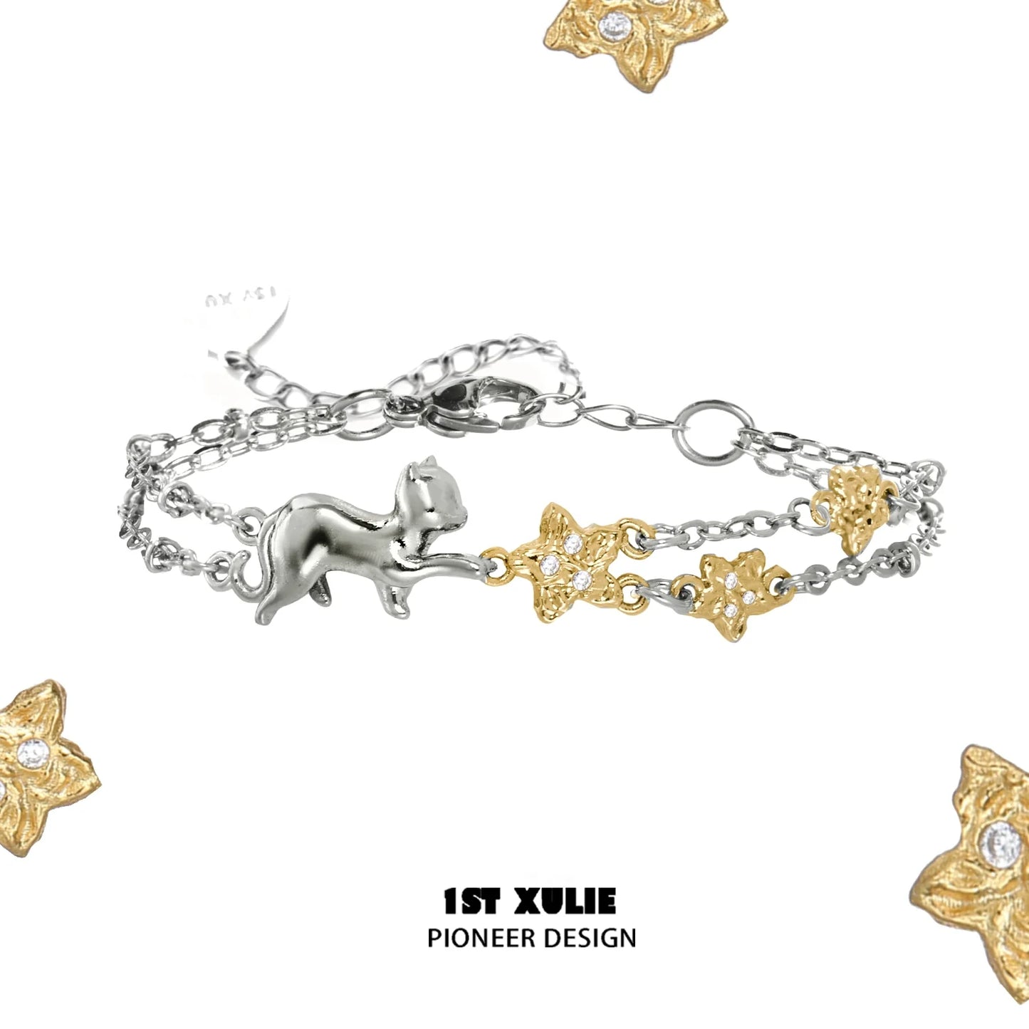 Delicate cat star bracelet featuring silver cat charm and gold stars with sparkling accents