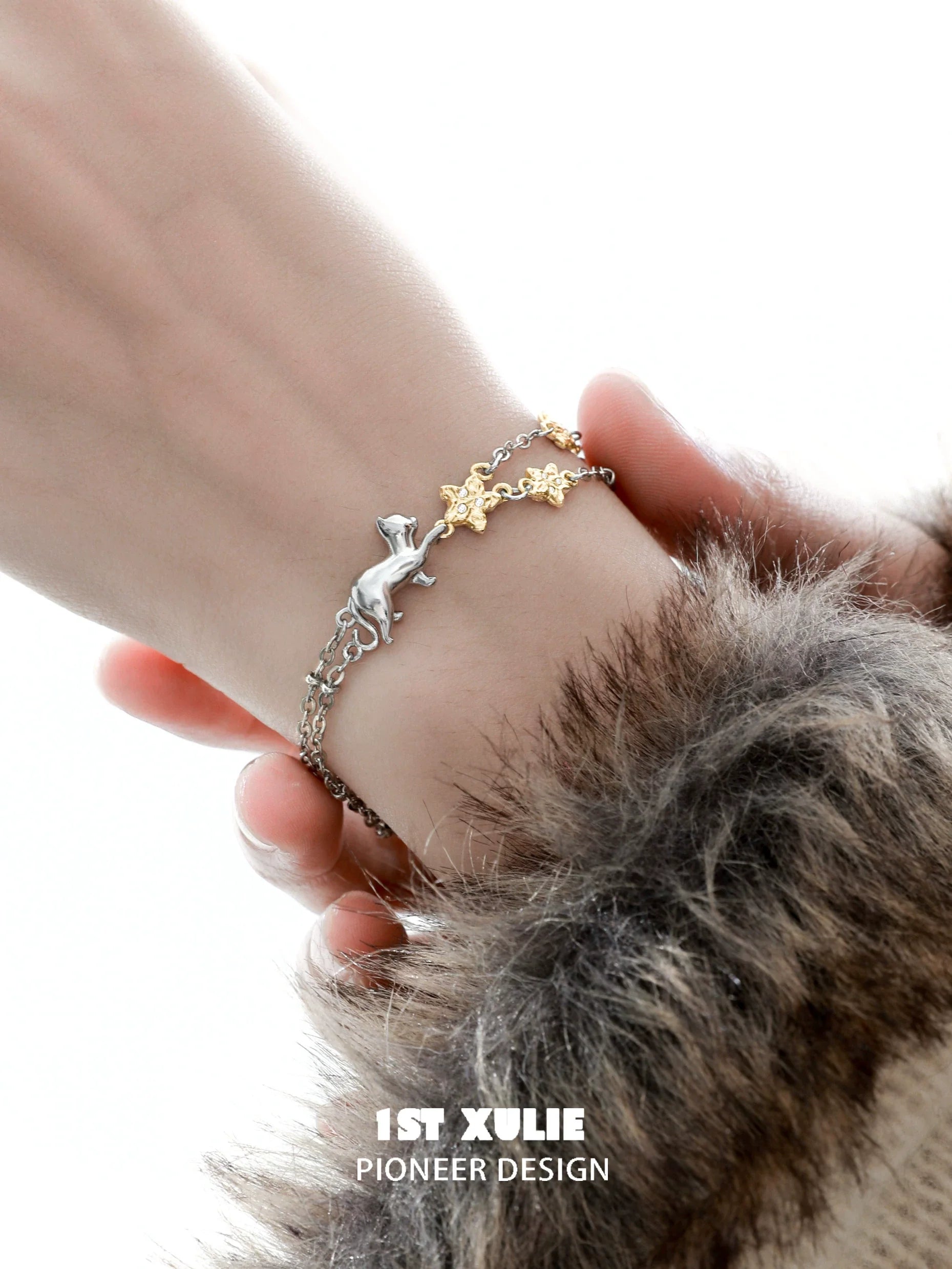 1STXULIE cat star bracelet featuring a silver cat and gold stars on a delicate chain