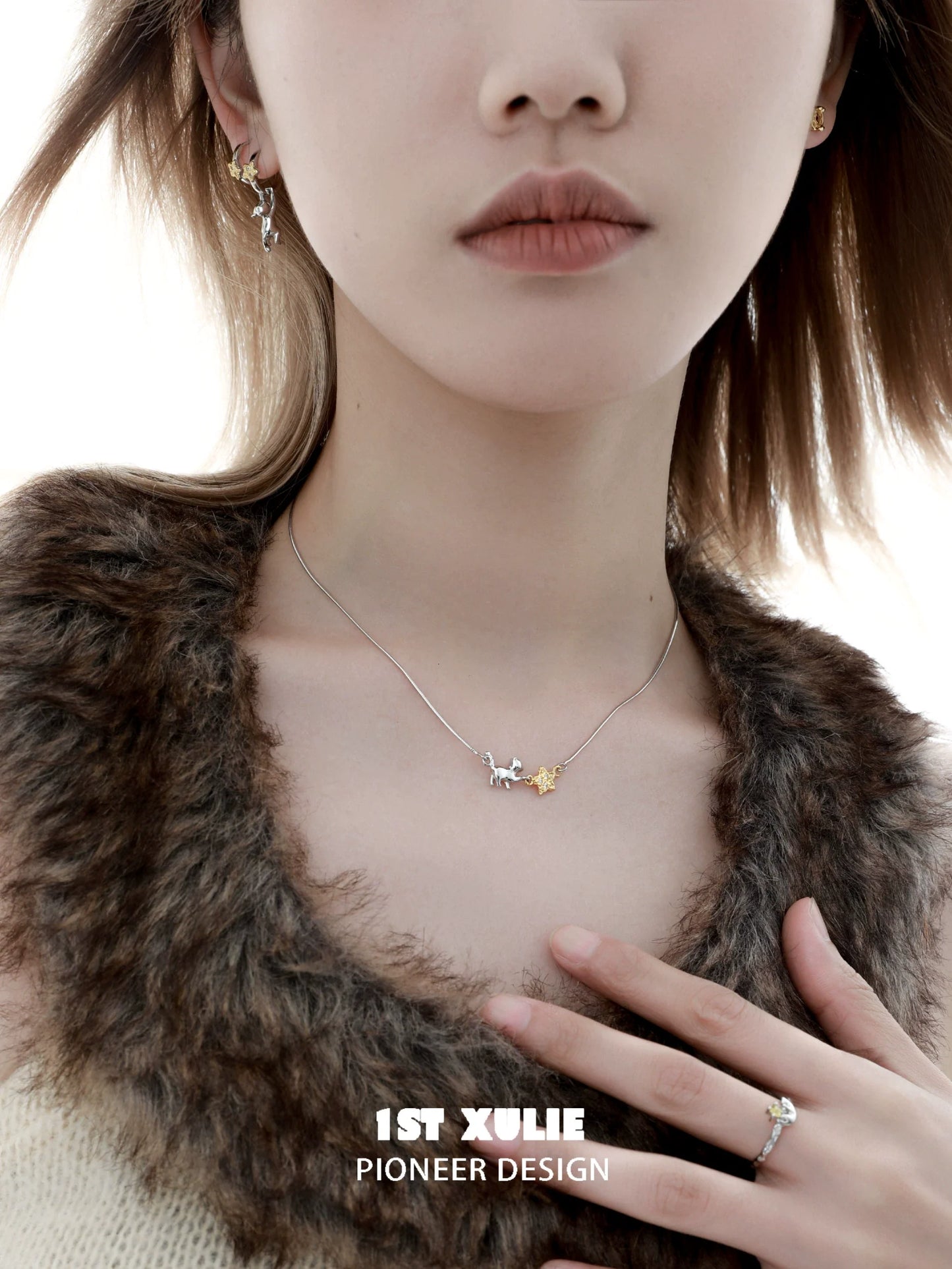 Elegant 1STXULIE cat star clavicle necklace on model with a chic outfit