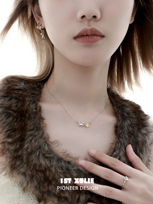 Elegant 1STXULIE cat star clavicle necklace on model with a chic outfit