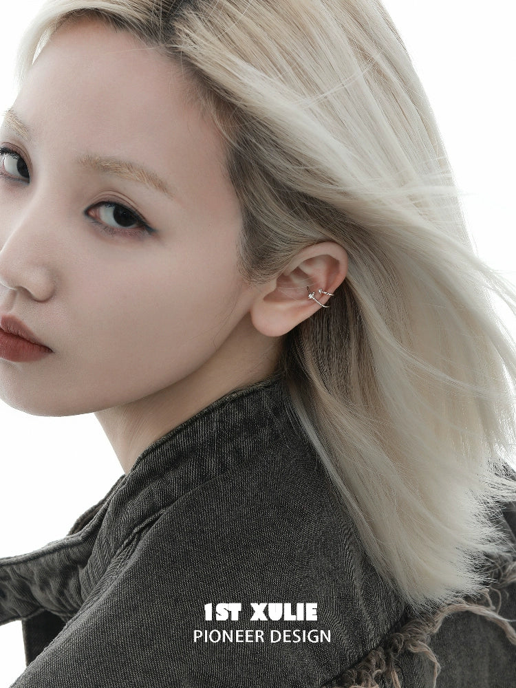 Model showcasing celestial zircon ear cuffs with a stylish and modern design against a neutral background.