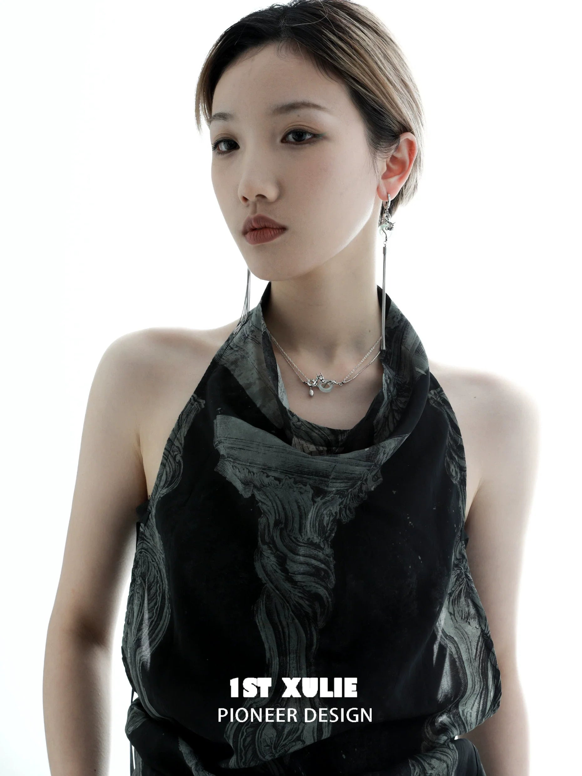 Elegant model showcasing Chinese dragon tassel earrings with intricate detailing and stylish design