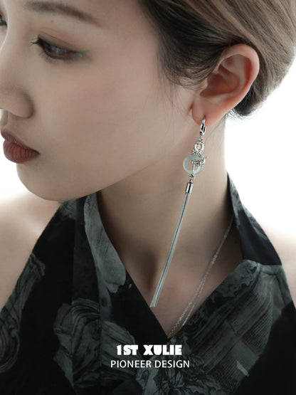 Trendy Chinese dragon tassel earrings featuring a sleek design and elegant silver accents