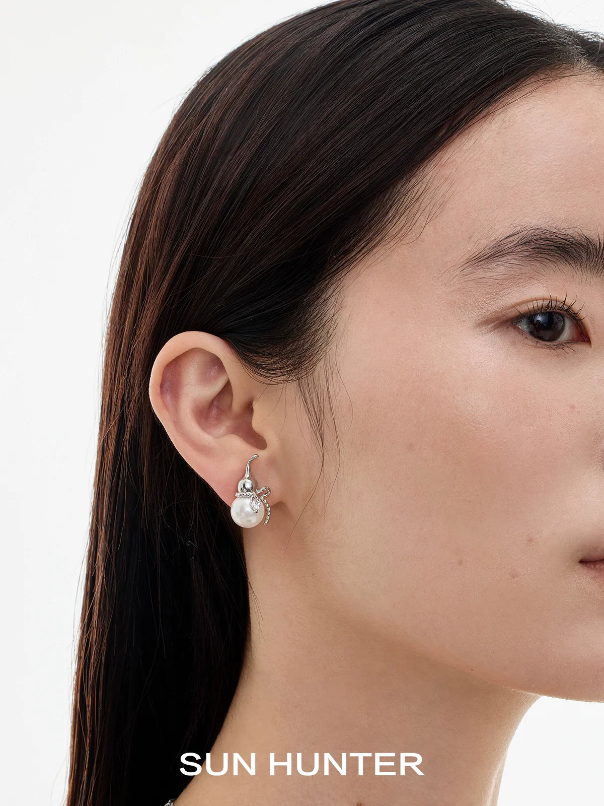 Elegant SUN HUNTER Chinese fortune gourd earrings with pearl details for a stylish look