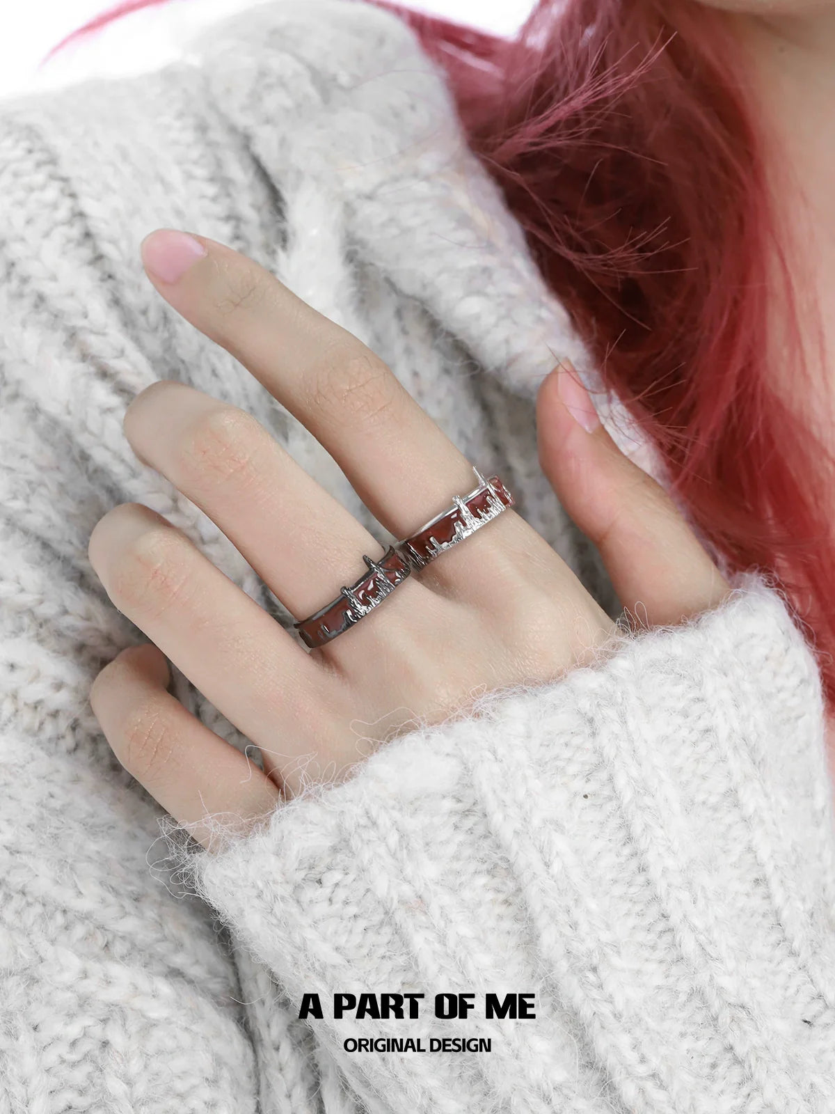 A PART OF ME city skyline silver ring worn on a hand with a cozy white sweater