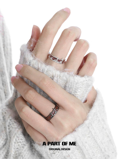 City skyline silver ring worn on fingers with a cozy sweater for stylish elegance