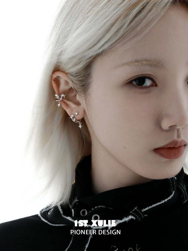 Model wearing a 1STXULIE cosmic star ear cuff adorned with unique star designs